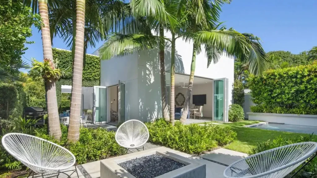 Modern landscaping style with clean lines, geometric layout, and minimal plants in backyard design